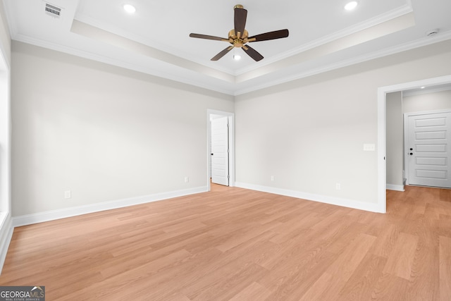 19 Honeysuckle Dr, Claxton, GA 30417 - spare room featuring a tray ceiling, ceiling fan, light wood-style flooring, ornamental molding, and recessed lighting