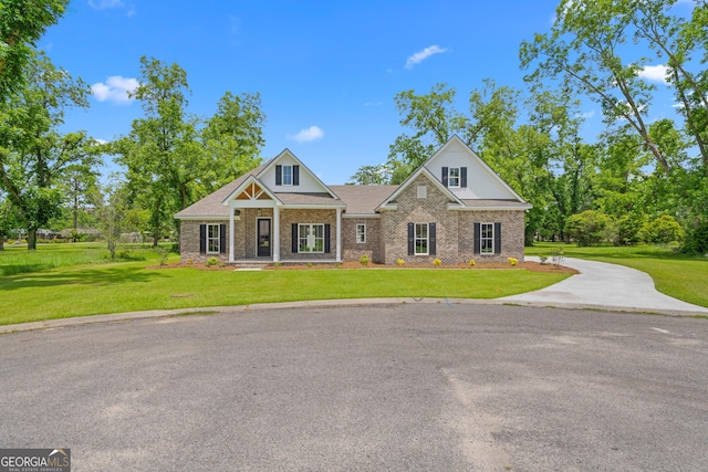 19 Honeysuckle Dr, Claxton, GA 30417 - craftsman inspired home featuring a front lawn and brick siding