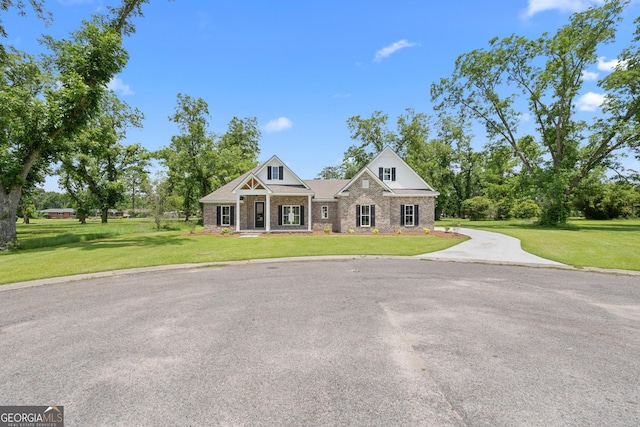 19 Honeysuckle Dr, Claxton, GA 30417 - craftsman inspired home with a front lawn, brick siding, and driveway