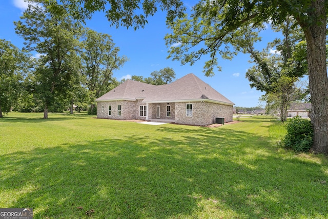 19 Honeysuckle Dr, Claxton, GA 30417 - rear view of property with a yard, a patio, and brick siding
