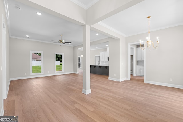 19 Honeysuckle Dr, Claxton, GA 30417 - unfurnished living room featuring a chandelier, a ceiling fan, ornamental molding, light wood-type flooring, and recessed lighting