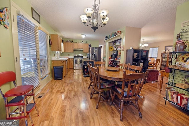 104 Bowers Cir, Blairsville, GA 30512 - dining space with a chandelier and light wood-type flooring