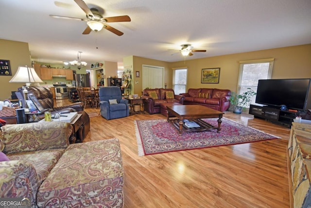 104 Bowers Cir, Blairsville, GA 30512 - living room featuring ceiling fan, light wood-style floors, and a chandelier