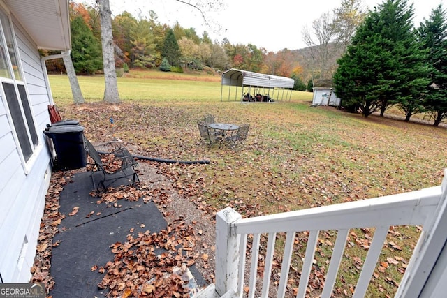 104 Bowers Cir, Blairsville, GA 30512 - view of green lawn featuring a carport and a shed