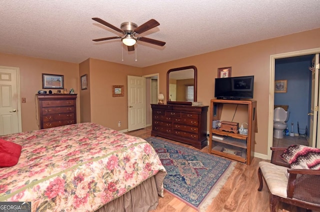 104 Bowers Cir, Blairsville, GA 30512 - bedroom featuring wood finished floors, a textured ceiling, and a ceiling fan