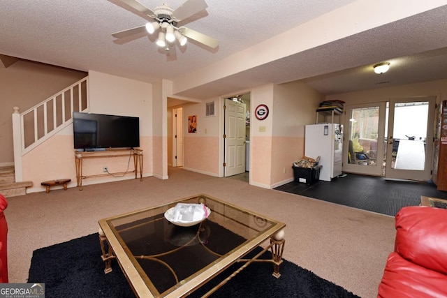 104 Bowers Cir, Blairsville, GA 30512 - carpeted living room featuring stairway, a textured ceiling, and ceiling fan