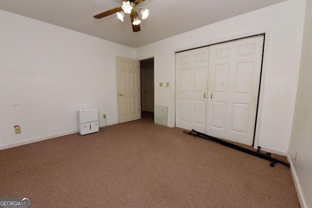 104 Bowers Cir, Blairsville, GA 30512 - unfurnished bedroom with carpet, a closet, and a ceiling fan