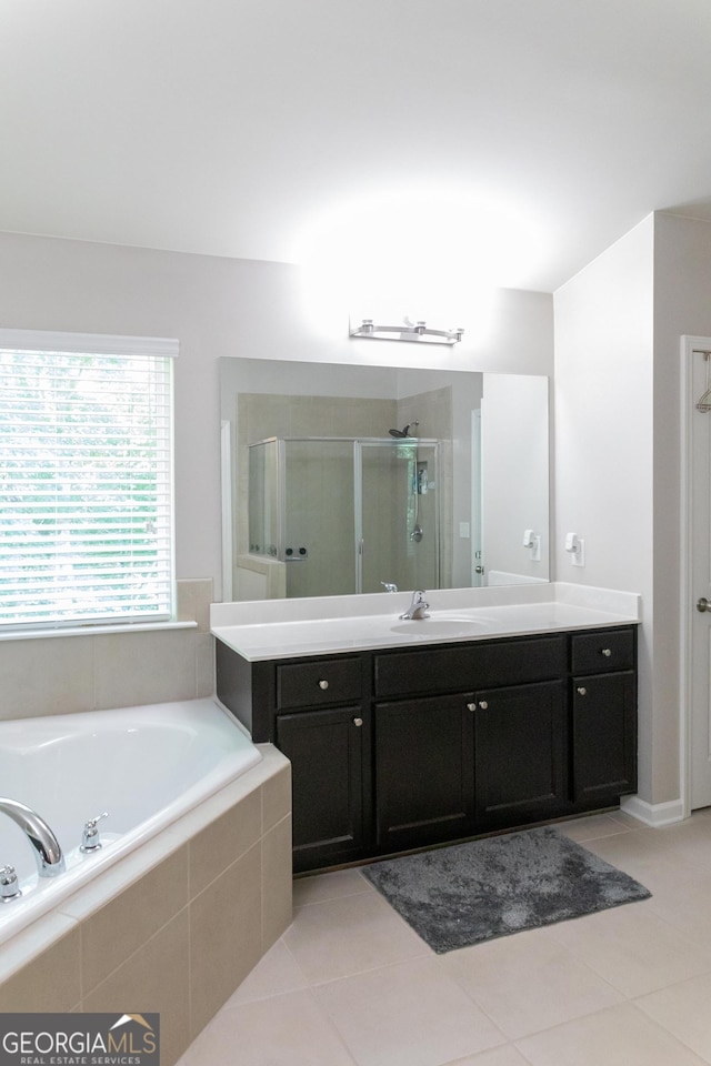 6695 Grove Meadows Ln, Cumming, GA 30028 - bathroom featuring vanity, a garden tub, a shower stall, and tile patterned flooring