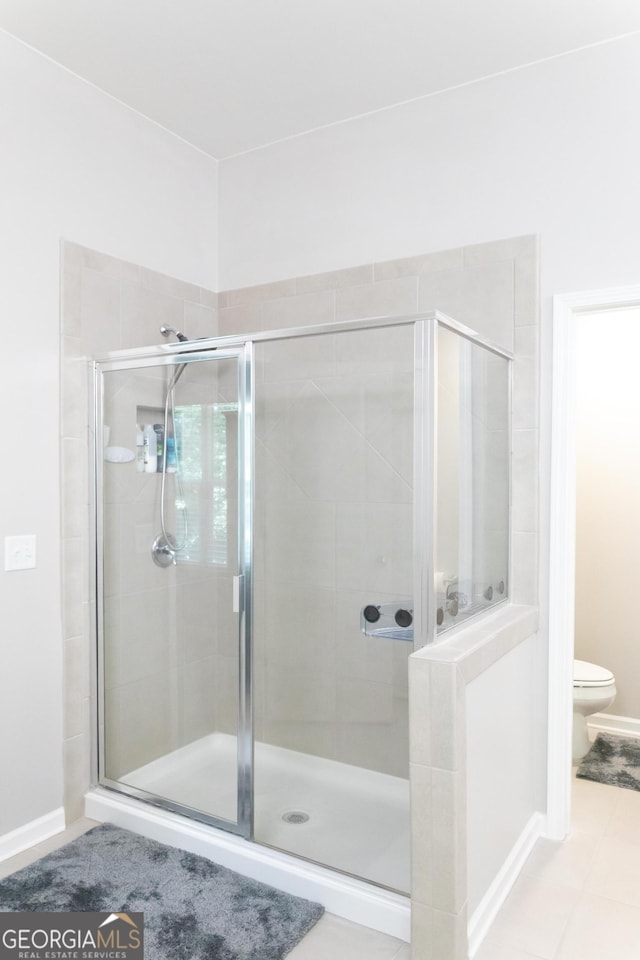 6695 Grove Meadows Ln, Cumming, GA 30028 - bathroom with toilet and a shower stall