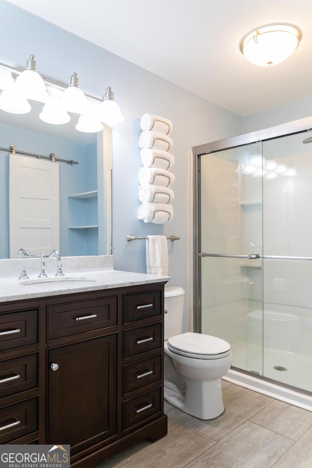 6695 Grove Meadows Ln, Cumming, GA 30028 - full bathroom with vanity, a shower stall, and wood finished floors