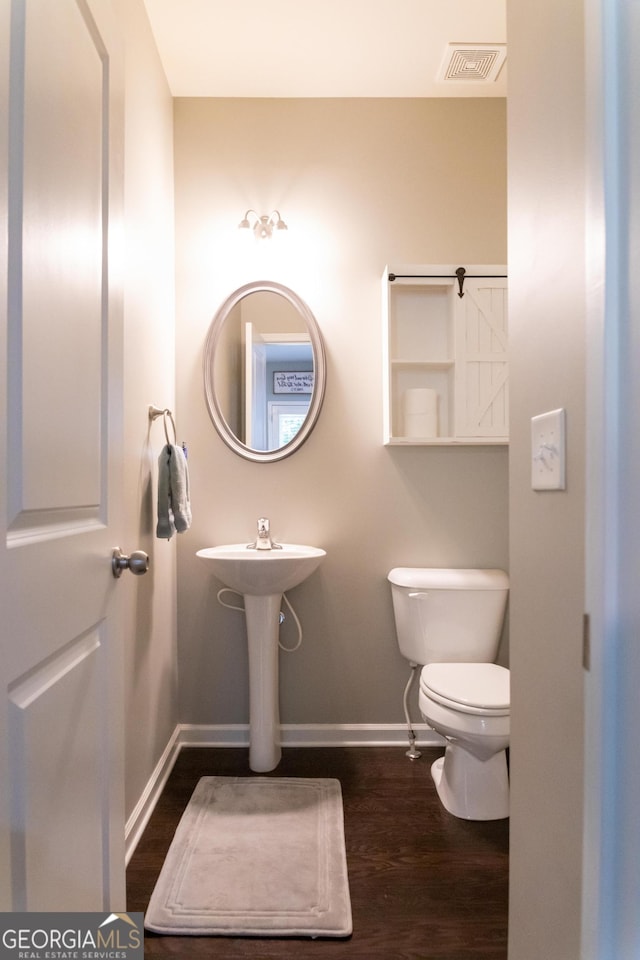 6695 Grove Meadows Ln, Cumming, GA 30028 - half bath with wood finished floors