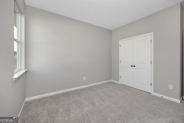 103 Gnome Ct, Perry, GA 31069 - unfurnished bedroom featuring carpet flooring and a closet