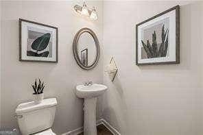 42 Buckingham Ln Unit 233, Hoschton, GA 30548 - bathroom with toilet and baseboards