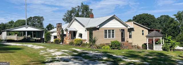 160 Buena Vista Dr, Eastanollee, GA 30538 - view of front of home featuring a front lawn, a gazebo, a chimney, driveway, and a carport