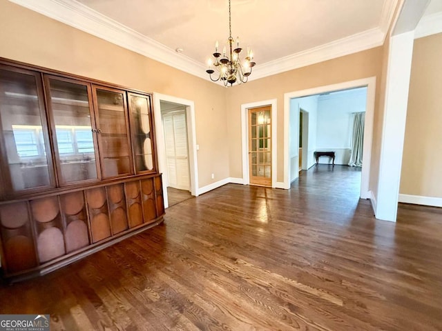 516 Longview St, Carrollton, GA 30117 - unfurnished dining area with a chandelier, crown molding, and dark wood finished floors