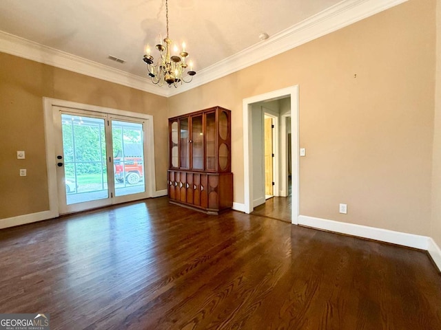 516 Longview St, Carrollton, GA 30117 - unfurnished room with a chandelier, dark wood-type flooring, and crown molding