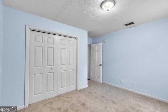 116 Overlook Bnd, Kingsland, GA 31548 - unfurnished bedroom featuring carpet flooring, a textured ceiling, and a closet