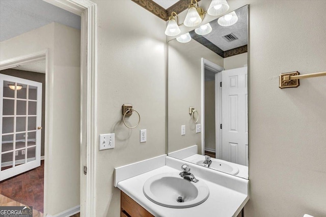 116 Overlook Bnd, Kingsland, GA 31548 - bathroom with a chandelier, vanity, and wood finished floors