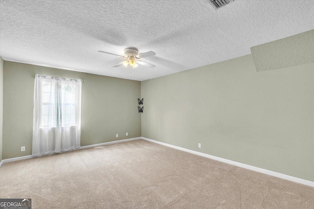 116 Overlook Bnd, Kingsland, GA 31548 - spare room with carpet floors, a ceiling fan, and a textured ceiling