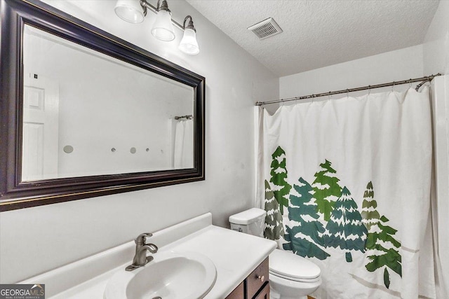 116 Overlook Bnd, Kingsland, GA 31548 - bathroom featuring vanity, a textured ceiling, and curtained shower