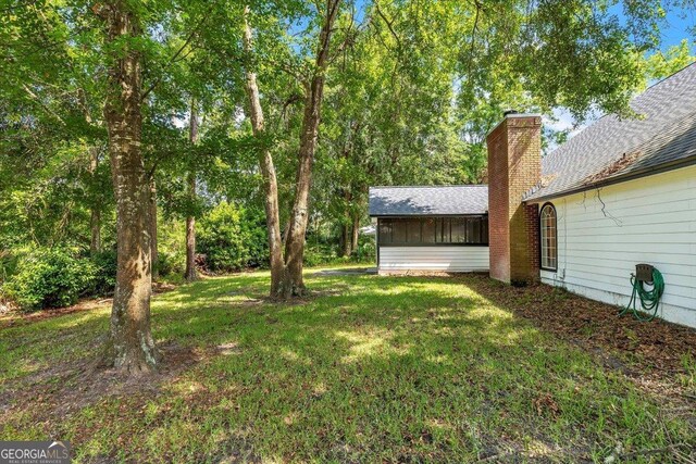 116 Overlook Bnd, Kingsland, GA 31548 - view of green lawn featuring a sunroom