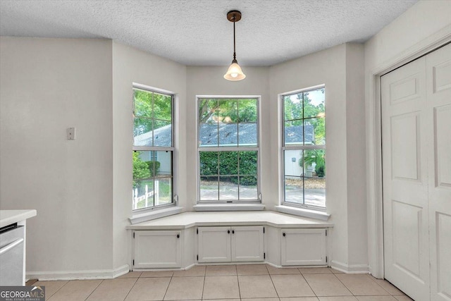 116 Overlook Bnd, Kingsland, GA 31548 - unfurnished dining area with light tile patterned flooring and a textured ceiling