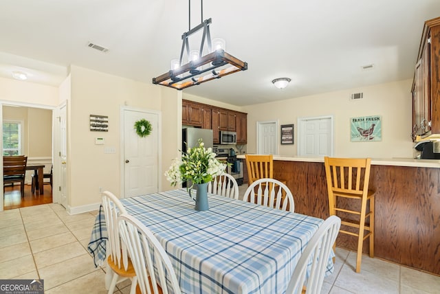595 Mcgarity Dr, Mcdonough, GA 30252 - dining space featuring light tile patterned floors