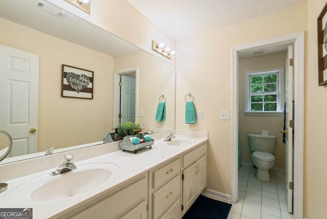 595 Mcgarity Dr, Mcdonough, GA 30252 - full bath with double vanity and tile patterned floors