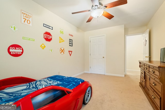 595 Mcgarity Dr, Mcdonough, GA 30252 - bedroom with light colored carpet and ceiling fan