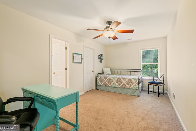 595 Mcgarity Dr, Mcdonough, GA 30252 - bedroom featuring light colored carpet and a ceiling fan