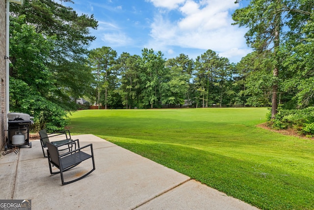 595 Mcgarity Dr, Mcdonough, GA 30252 - view of green lawn with a patio area, view of scattered trees, and golf course view