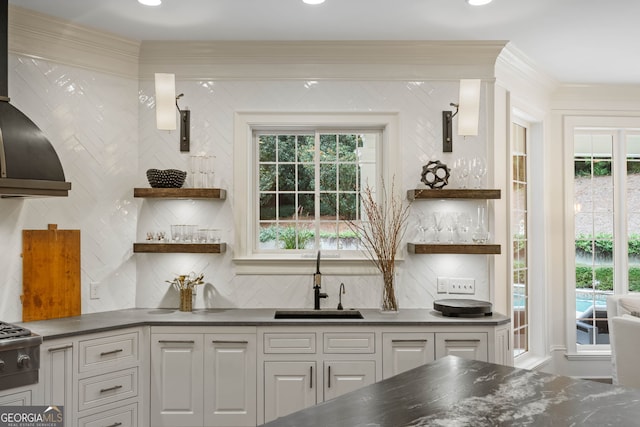 3401 Stillhouse Rd SE, Atlanta, GA 30339 - kitchen with open shelves, dark countertops, tasteful backsplash, white cabinets, and crown molding
