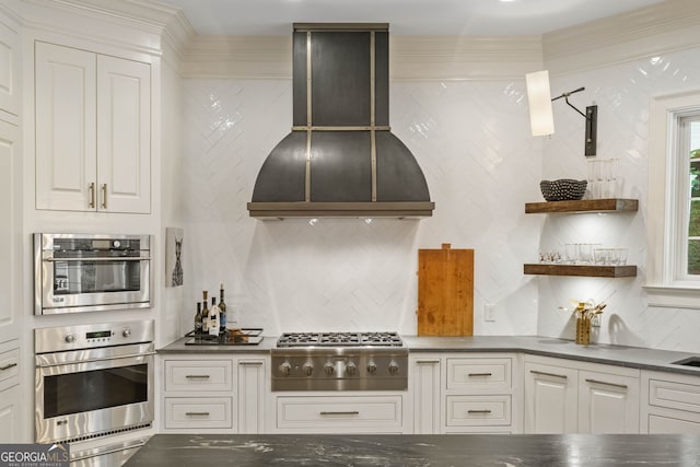 3401 Stillhouse Rd SE, Atlanta, GA 30339 - kitchen featuring stainless steel appliances, exhaust hood, tasteful backsplash, white cabinets, and a warming drawer