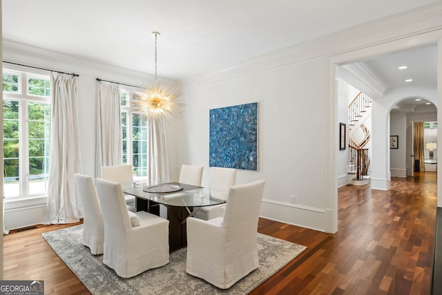 3401 Stillhouse Rd SE, Atlanta, GA 30339 - dining room featuring arched walkways, ornamental molding, plenty of natural light, wood finished floors, and recessed lighting