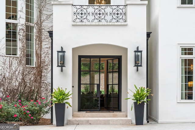 3401 Stillhouse Rd SE, Atlanta, GA 30339 - doorway to property featuring stucco siding and a balcony