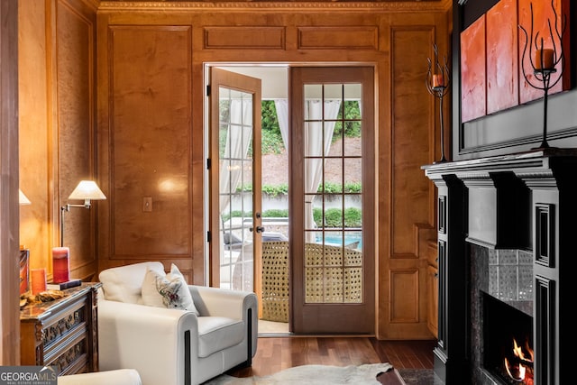 3401 Stillhouse Rd SE, Atlanta, GA 30339 - doorway with a fireplace, wood finished floors, a decorative wall, and wood walls
