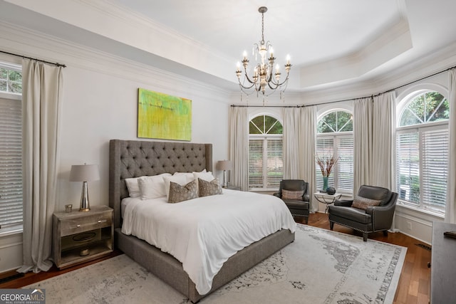 3401 Stillhouse Rd SE, Atlanta, GA 30339 - bedroom with a chandelier, crown molding, multiple windows, and wood finished floors