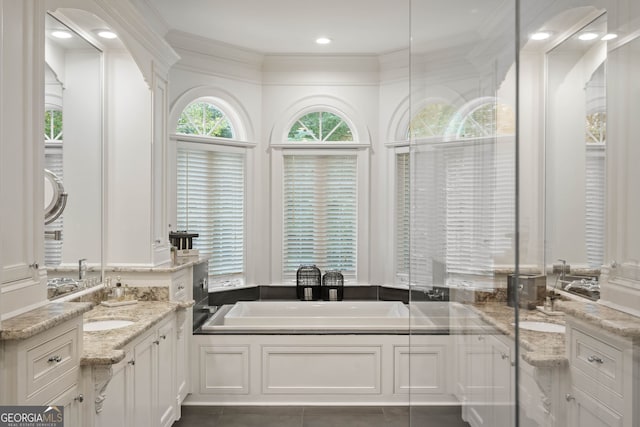 3401 Stillhouse Rd SE, Atlanta, GA 30339 - bathroom with a bath, vanity, ornamental molding, and recessed lighting