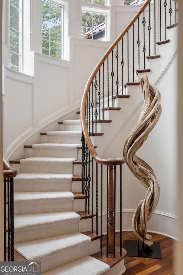3401 Stillhouse Rd SE, Atlanta, GA 30339 - stairway with wood finished floors and baseboards