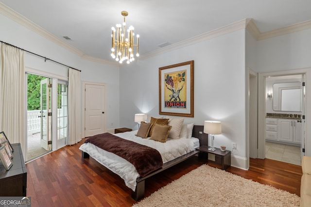 3401 Stillhouse Rd SE, Atlanta, GA 30339 - bedroom featuring access to exterior, a chandelier, ornamental molding, wood finished floors, and connected bathroom