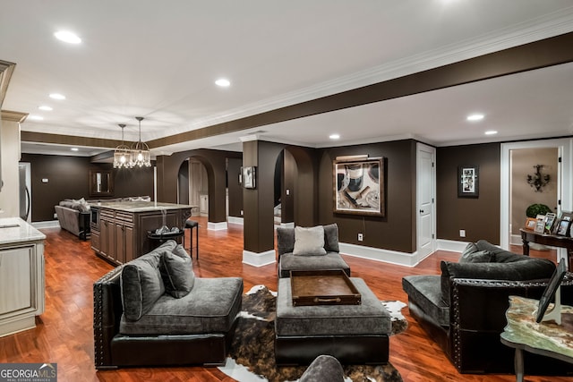 3401 Stillhouse Rd SE, Atlanta, GA 30339 - living area featuring arched walkways, crown molding, wood finished floors, recessed lighting, and a chandelier