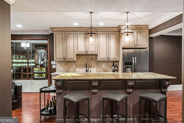 3401 Stillhouse Rd SE, Atlanta, GA 30339 - kitchen with stainless steel refrigerator with ice dispenser, dark wood-type flooring, light stone counters, decorative backsplash, and pendant lighting
