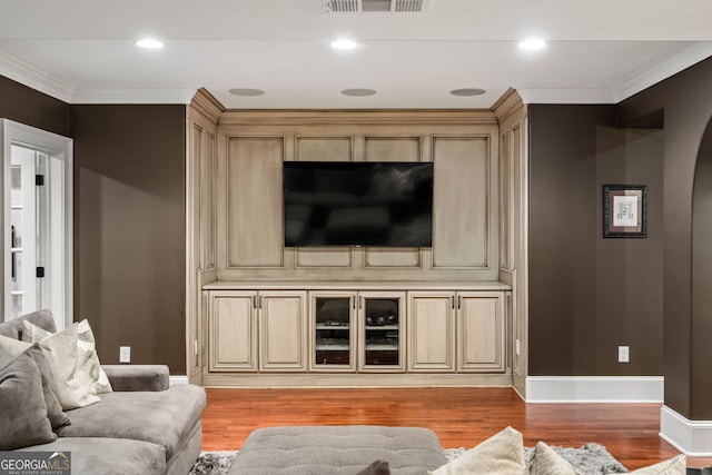 3401 Stillhouse Rd SE, Atlanta, GA 30339 - living room with light wood-type flooring, arched walkways, and ornamental molding