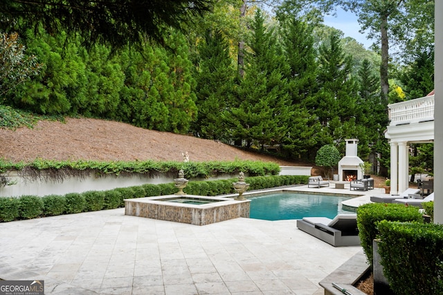 3401 Stillhouse Rd SE, Atlanta, GA 30339 - view of swimming pool with a lit fireplace, a patio area, and a pool with connected hot tub