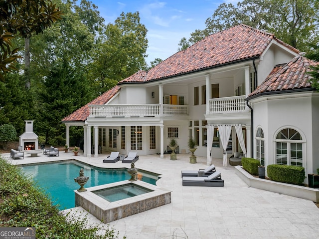 3401 Stillhouse Rd SE, Atlanta, GA 30339 - back of property with a patio area, a balcony, stucco siding, and a tile roof