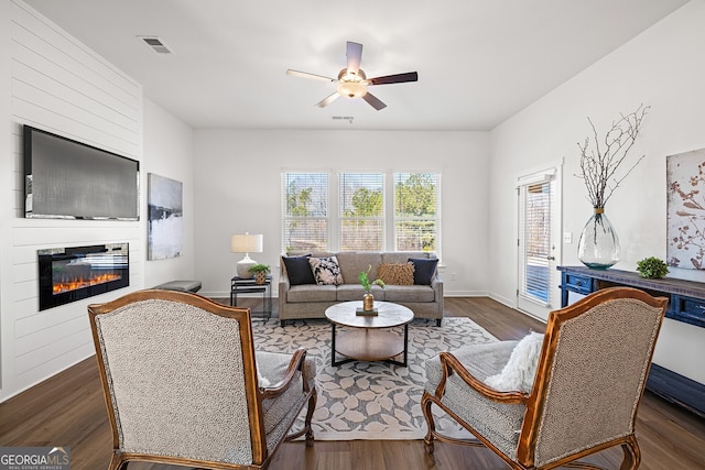 1313 Pj E Rd, Covington, GA 30014 - living room featuring a ceiling fan, a fireplace, and wood finished floors