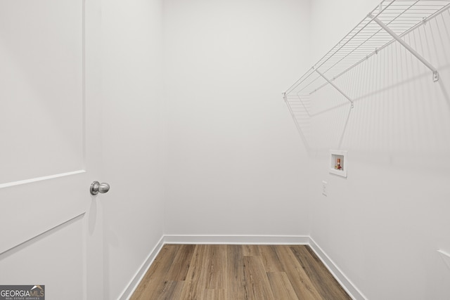 1313 Pj E Rd, Covington, GA 30014 - washroom with hookup for a washing machine and wood finished floors