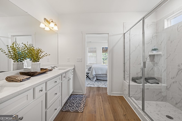 1313 Pj E Rd, Covington, GA 30014 - ensuite bathroom with double vanity, wood finished floors, and a marble finish shower