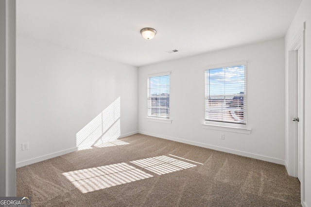 1313 Pj E Rd, Covington, GA 30014 - empty room featuring carpet floors and baseboards