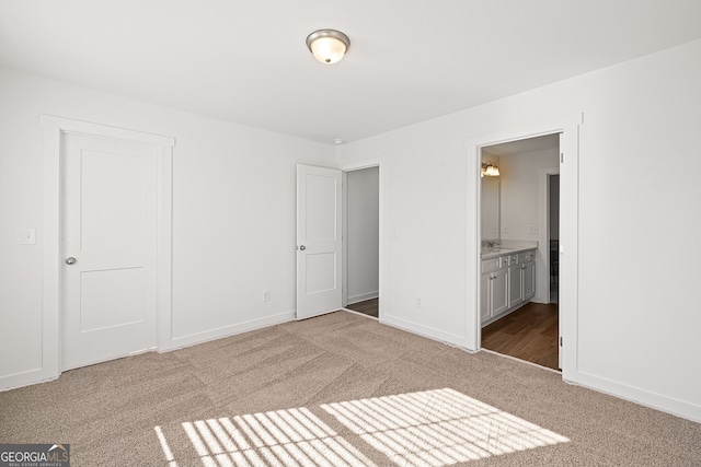 1313 Pj E Rd, Covington, GA 30014 - unfurnished bedroom featuring carpet floors and ensuite bath